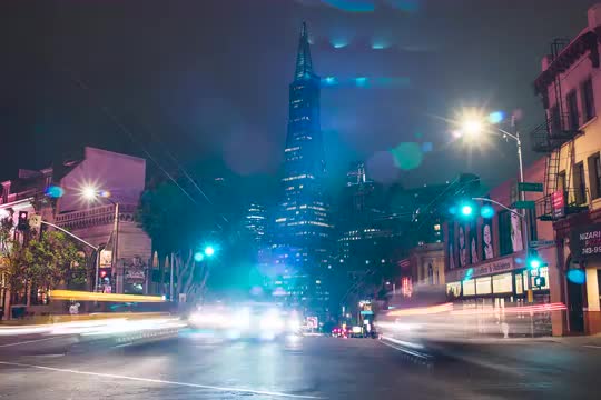 Bustling city traffic timelapse showcasing San Francisco's Transamerica Pyramid Tower at night