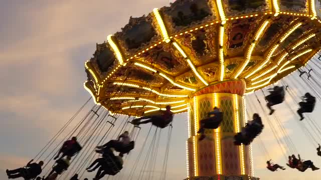 people riding in merry go round in Stockholm