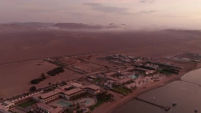 Aerial landscape over empty tourist resorts in Paracas Peru
