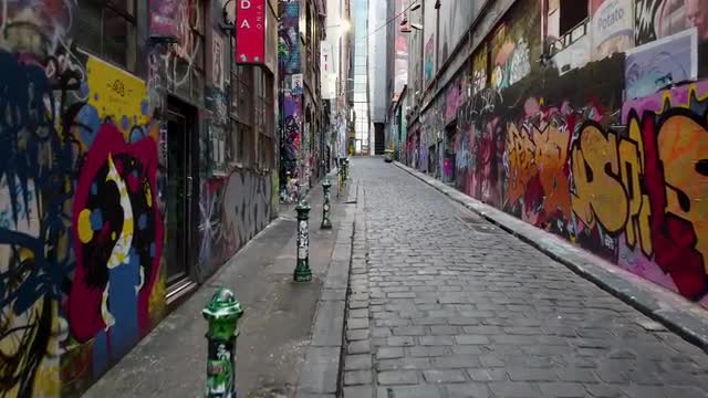 Empty alleyway covered in graffiti