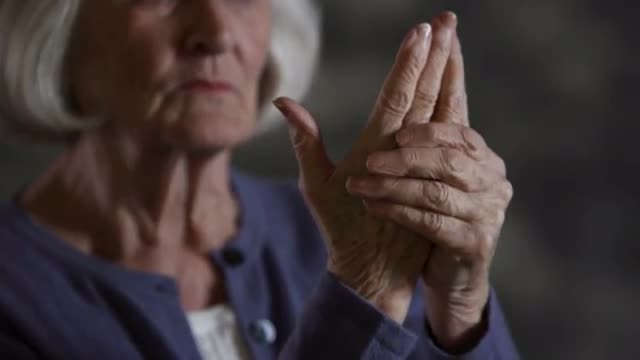 Elderly woman with arthritis