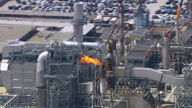 Flames from stack at oil refinery, aerial shot