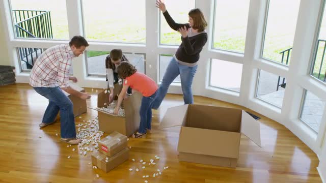 Family having fun in new home