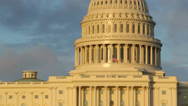 Closeup of flag waving on US Capitol Building, Washington DC