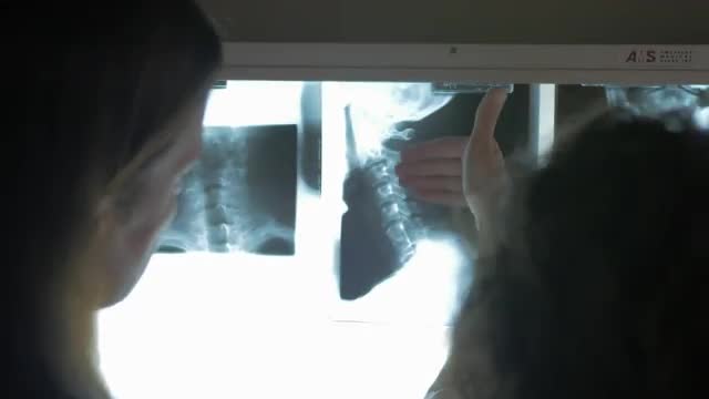 4k Closeup of Chiropractor, Patient, X-Ray