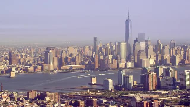 LONG AERIAL over New Jersey with Lower Manhattan skyline in background