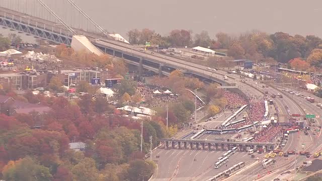 AERIAL NUMEROUS SHOTS 5 Marathon runners at the foot of the Verrazano Bridge