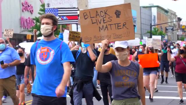 View of People Marching at a Black Lives Matter March 