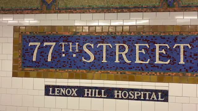 This is the 77th Street Subway Station Wall Sign