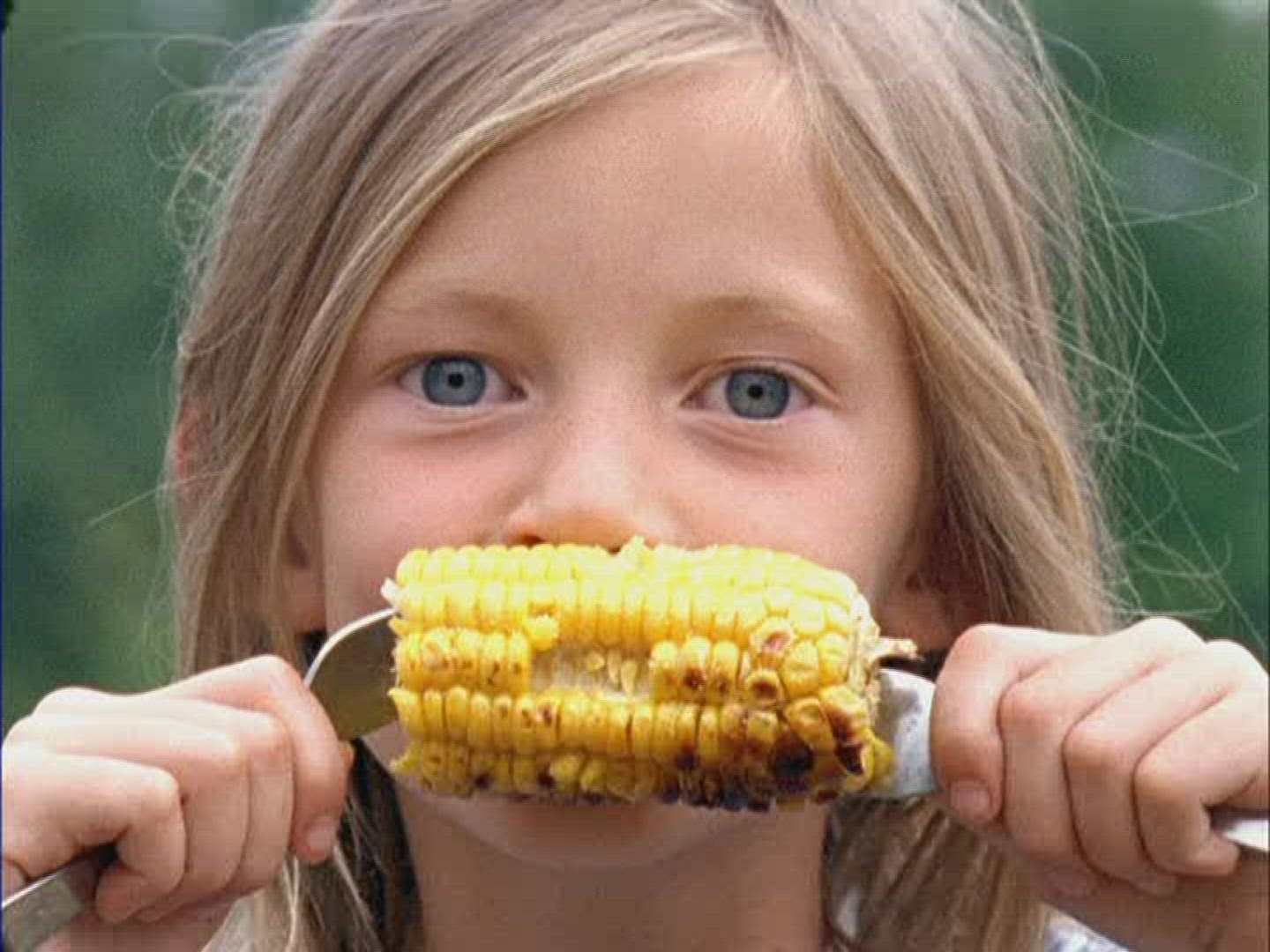 402701197 / Girl / Eating / Grimace / Germany