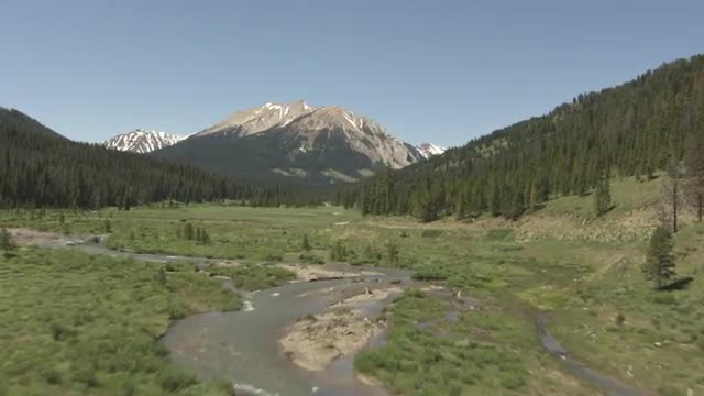 CineFlex over a Winding River next to a Dirt Road_1