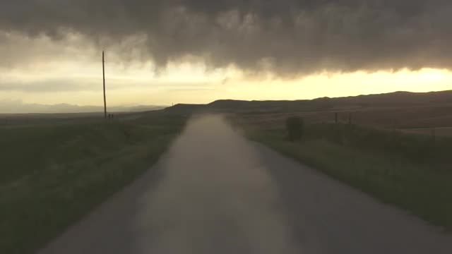 POV of Back of Moving Truck along Dirt Road_3