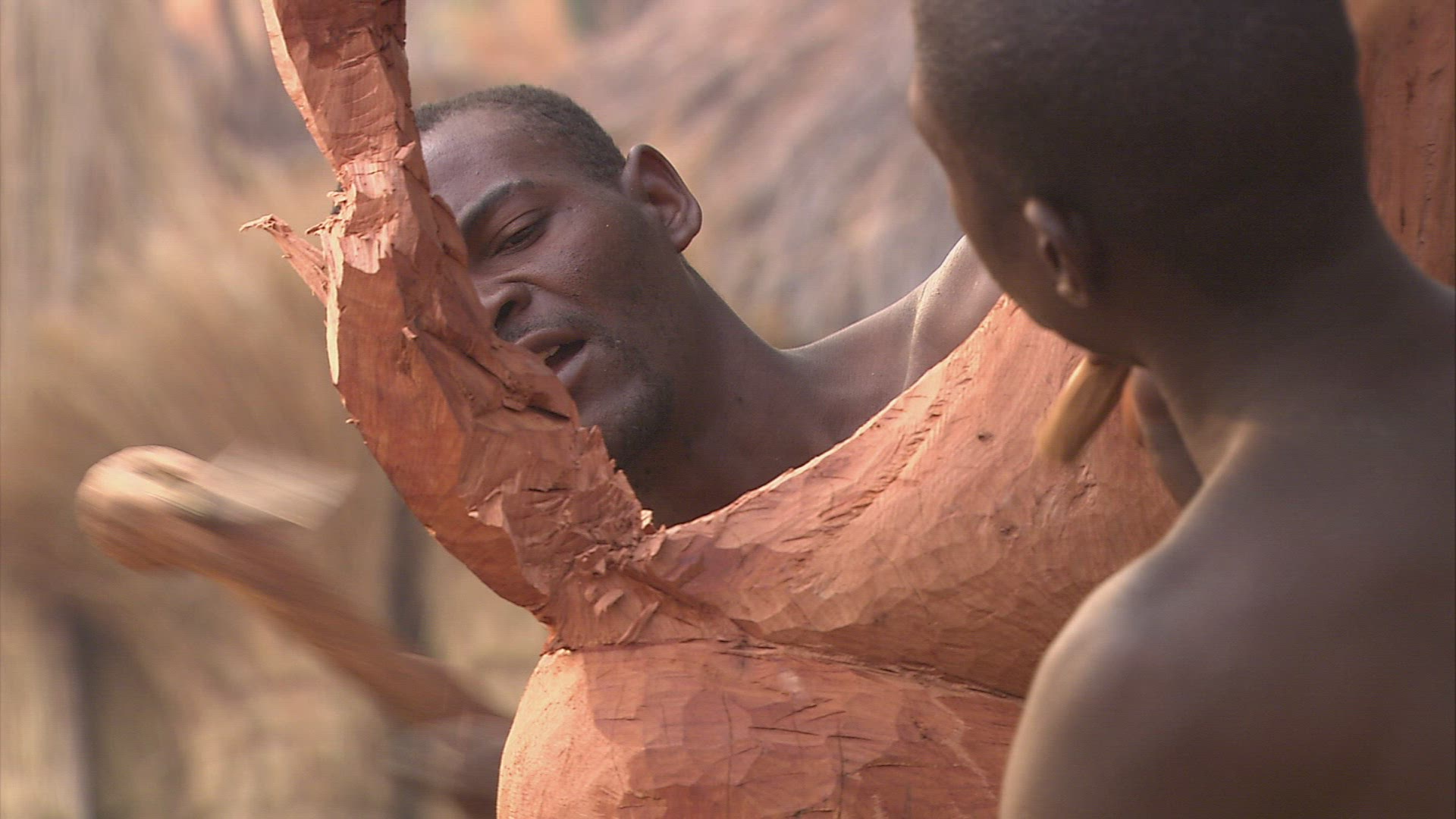 254868944 / Man / Chiselling / Wooden Sculpture / Zambia