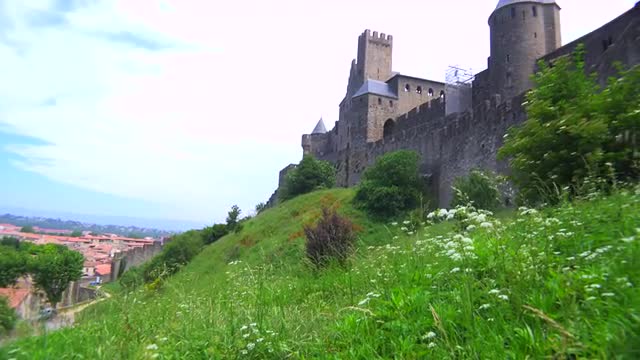 Tilt up from fields to  the beautiful castle fort at Carcassonne France.