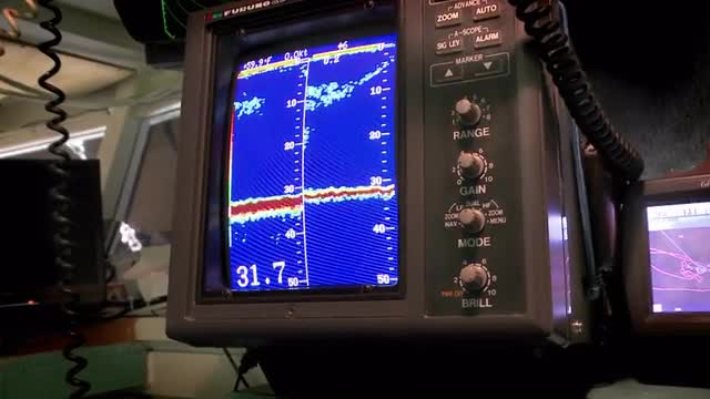 A sea vessel uses a piece of sonar equipment.