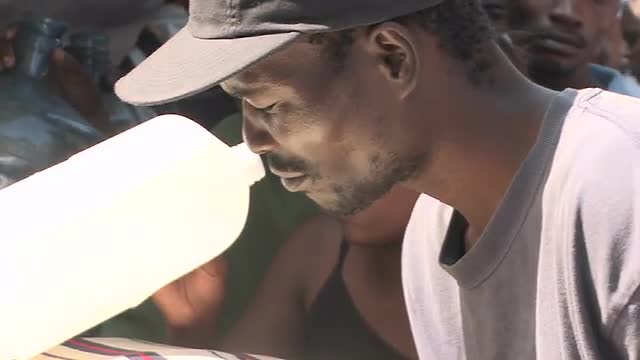 Earthquake refugees line up for supplies in Haiti.