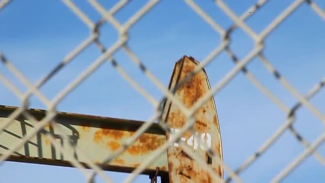 A single rig pumps oil in an oil field.