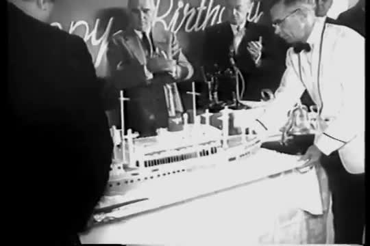 Herbert Hoover celebrates his 83rd birthday onboard the S.S. President Hoover in 1957.
