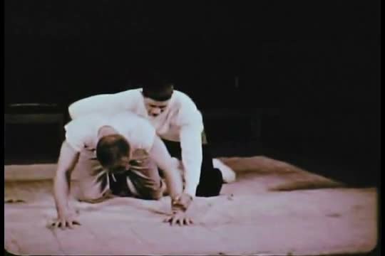 This 1950s film displays a young man shaving and a young woman concerned about her weight as they gr