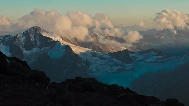 Sun and cloud moving over Caucasus Mountains