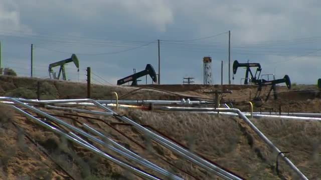 Oil pumps operate in an oil field.