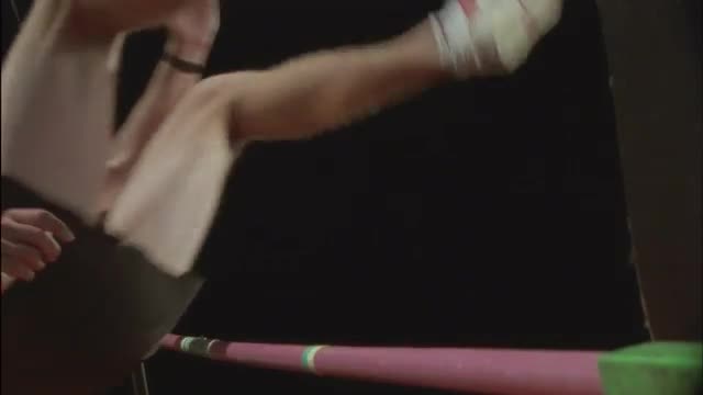 A man performs a high jump over a bar.
