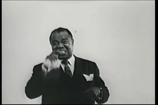 Louis Armstrong seems pretty excited about the Suzy Cute doll in this 1950s commercial