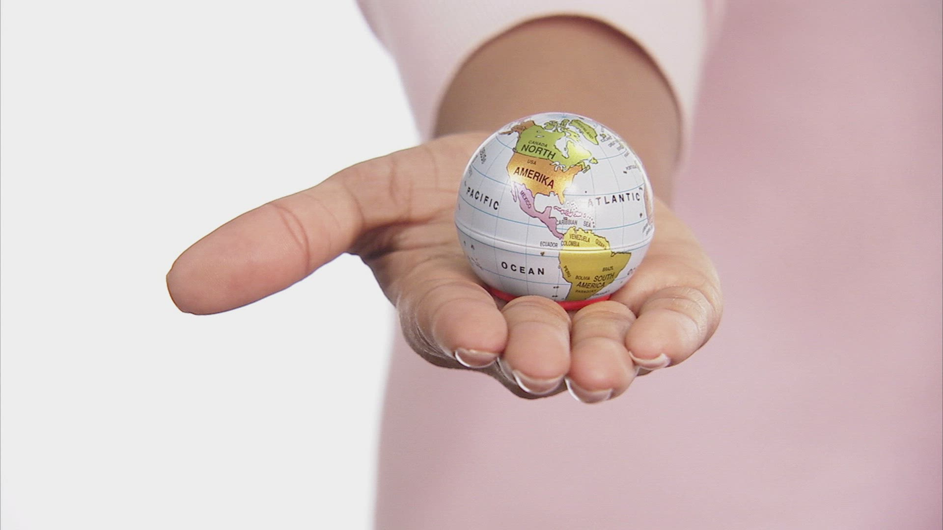 511799508 / Scandinavian Ethnicity / Globe / Holding