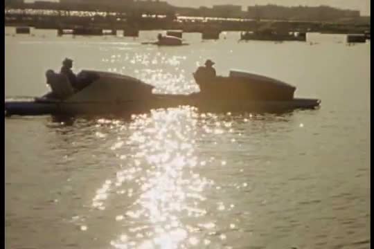 1939 NYC World fair fountain lakes and boaters are shown.