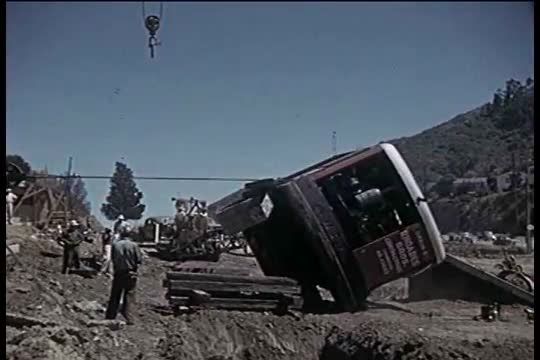 Construction of a broad highway or freeway by hand in Southern California in the early 1960's.