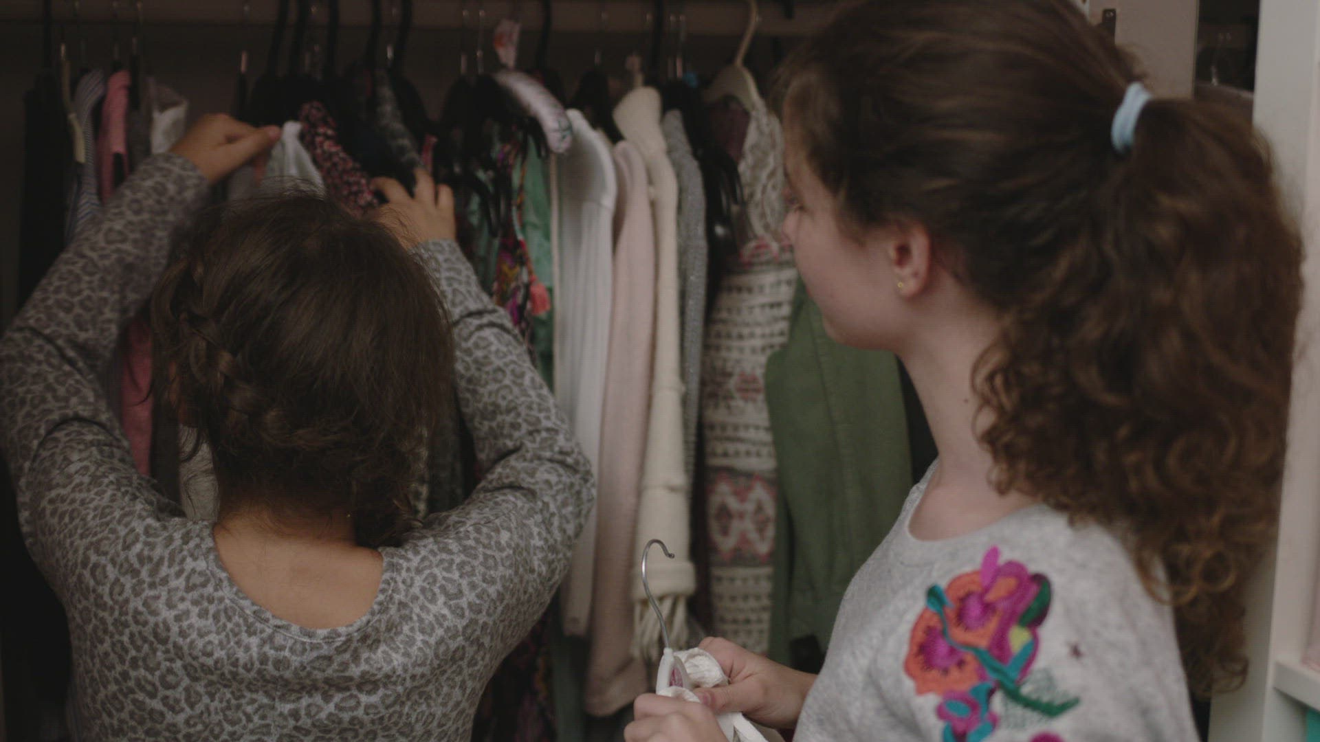 Sister changing clothes in front of brother