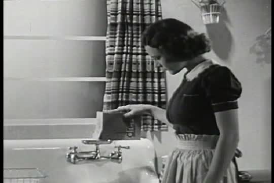 Screen advertisement for Dreft detergent, featuring a demonstration.