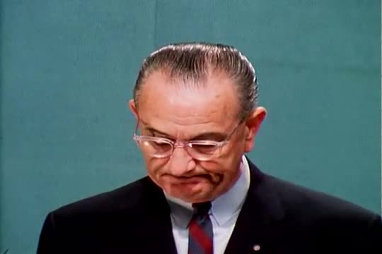 A man delivers a speech about his experience with the C.I.A. in honor of Richard Helms being appoint