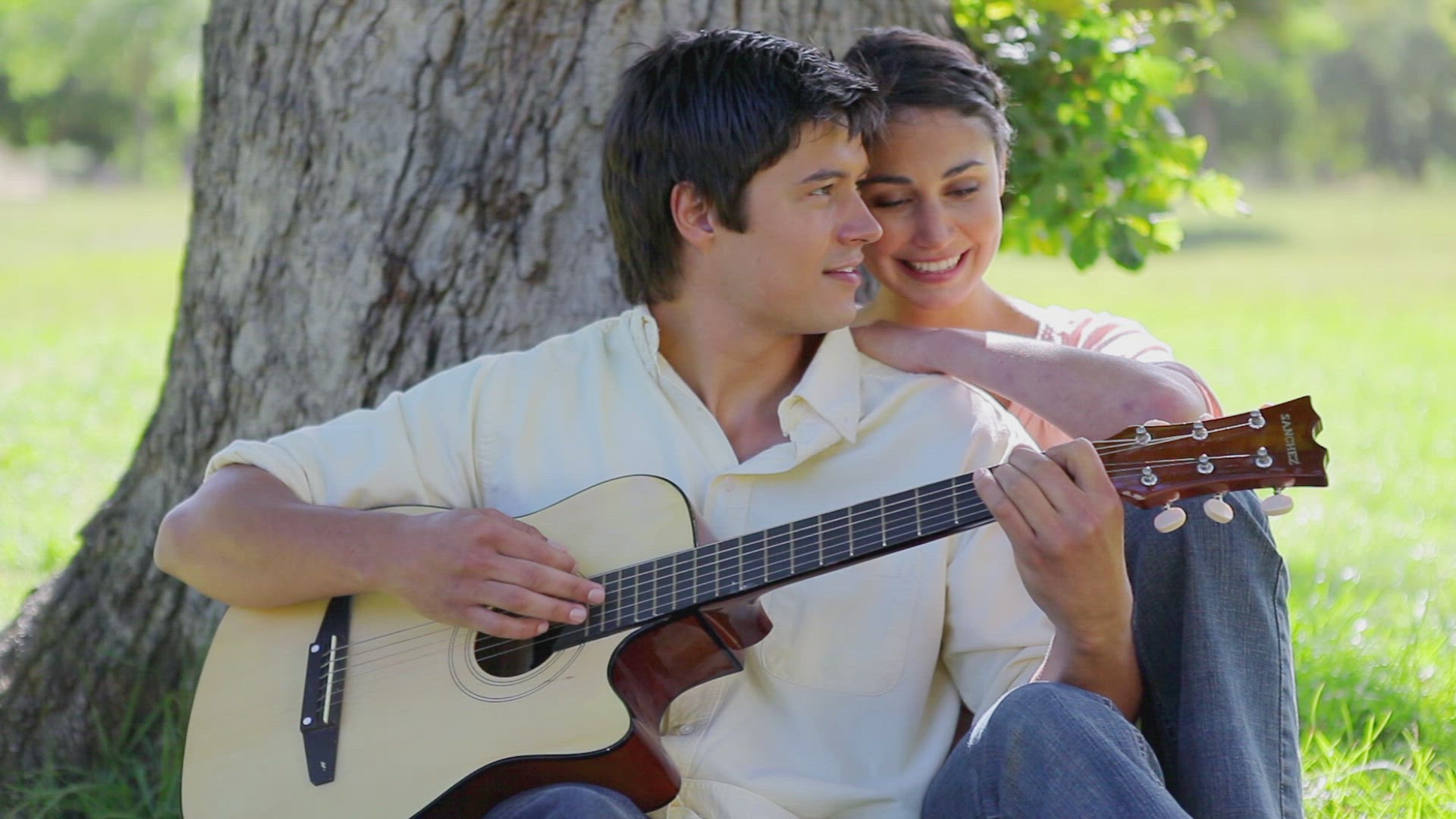 146641751 / Couple / Acoustic Guitar / Playing