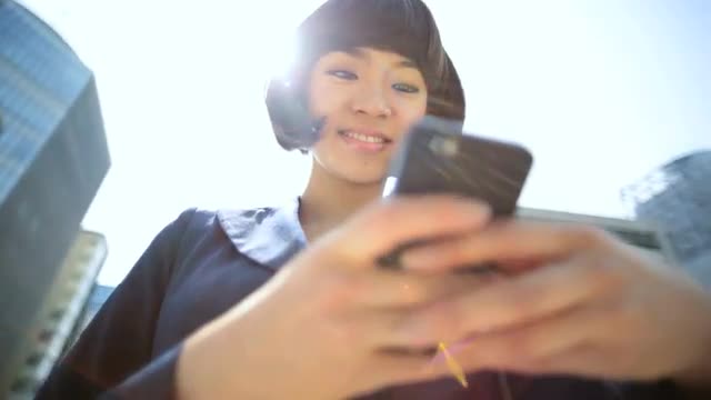 Young Ethnic Asian Japanese Businesswoman City Downtown Smart Phone Device