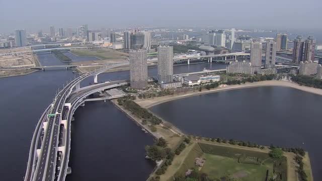 Aerial elevated vehicle traffic Tokyo Bay Shuto Expressway nautical vessels 