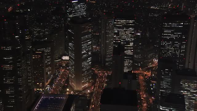 Aerial Tokyo City night illuminated skyscrapers Central Business District Japan