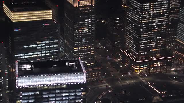Aerial Tokyo close up illuminated people skyscrapers Shibuya Business District Japan 