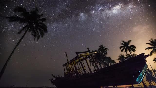 Time lapse of milky way rising behind an abandoned shipwrecked
