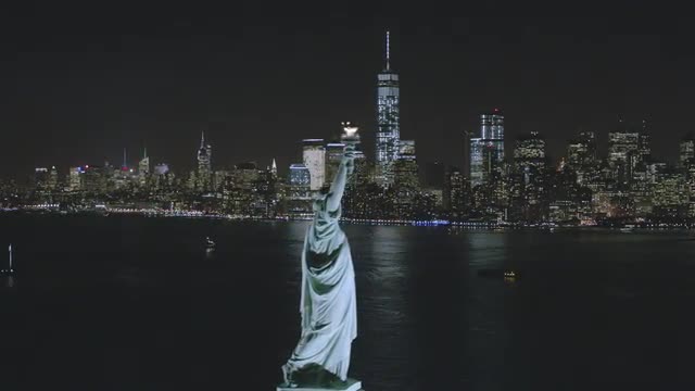 WIDE AERIAL NYC view with a Statue of Liberty FLYBY over the Harbor 
