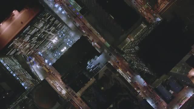 OVERHEAD POV AERIAL over streets and buildings of Midtown