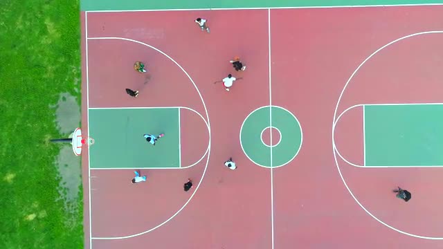 People Playing Basketball at a City Park in Chicago - Descending Bird's Eye View