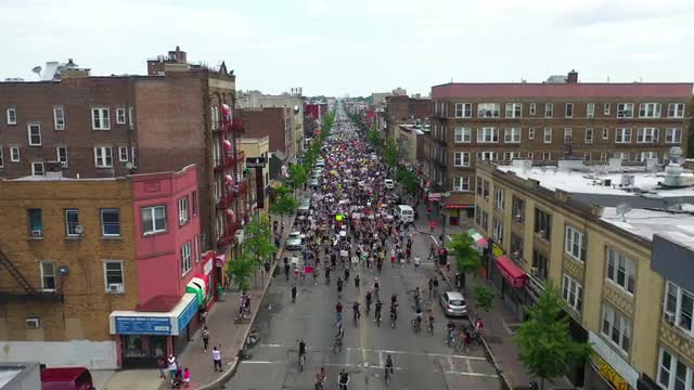 Descending Aerial Shot of People Marching at a Black Lives Matter March in West New York