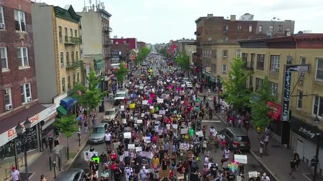 Aerial Flyover Shot of People Marching at a Black Lives Matter March in West New York