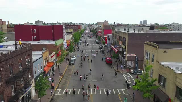 Aerial Flyover Shot of People Marching at a Black Lives Matter March in West New York