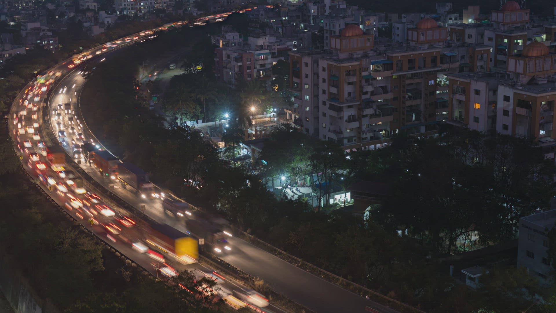 Aerial View of Time lapse of Busy Traffic on Mumbai Pune National Highway During Night, Pune, India