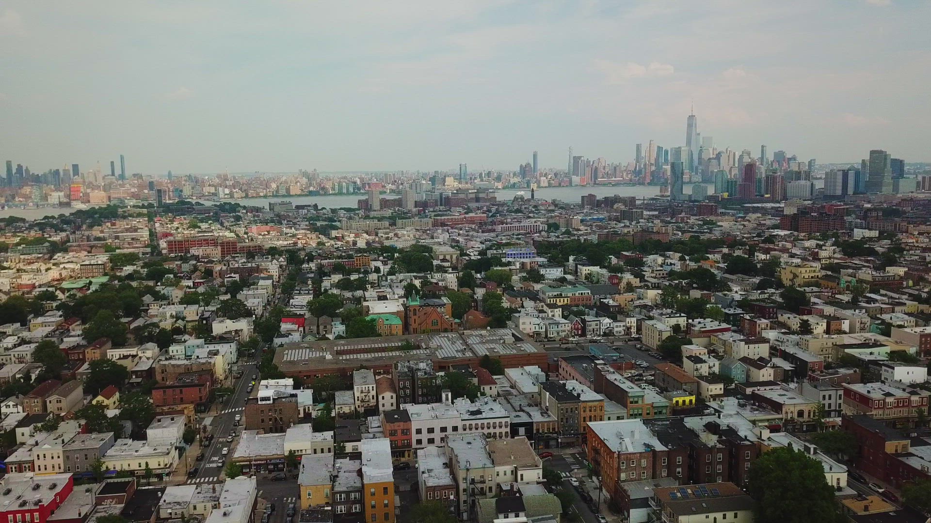 Aerial View of Jersey City Skyline and New York City Skyline - Panning Shot 2