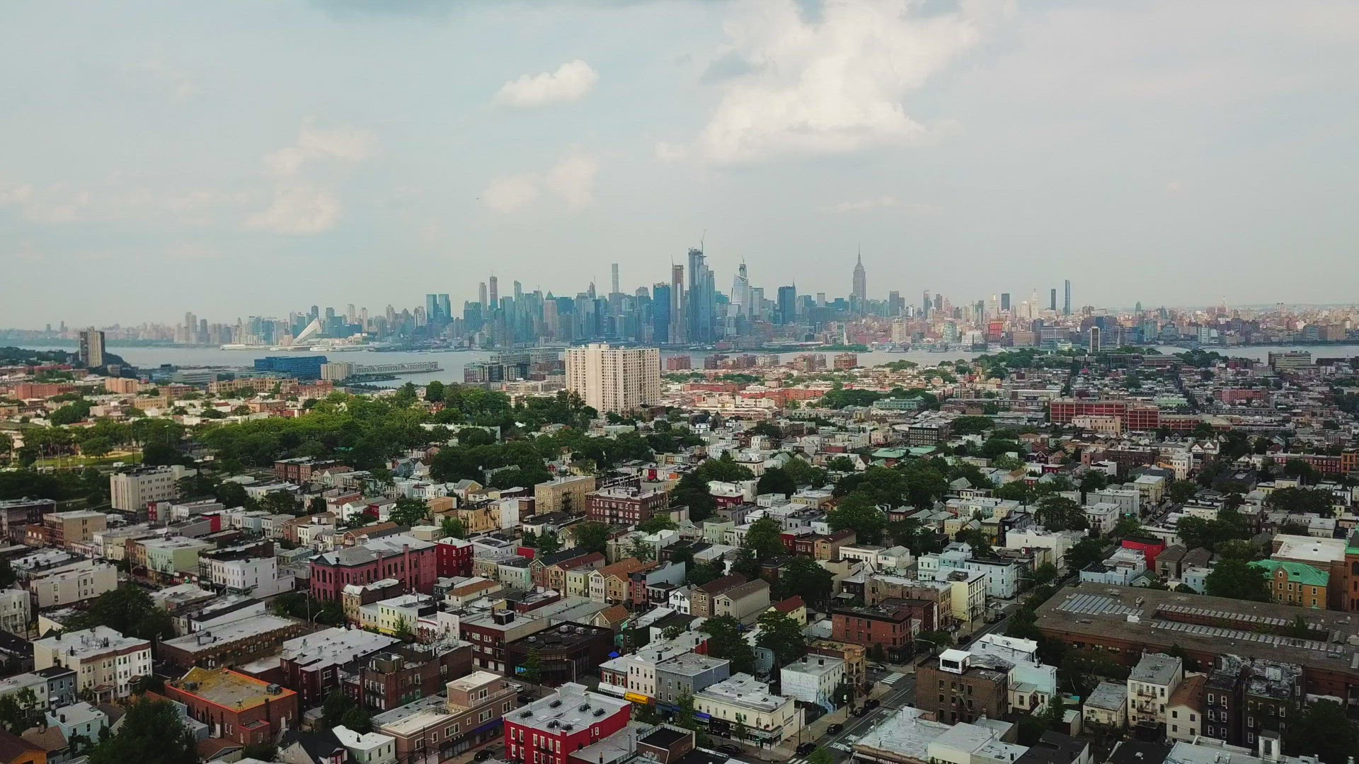 Distant View of Midtown Manhattan Skyline from Jersey City - Descending Crane Shot