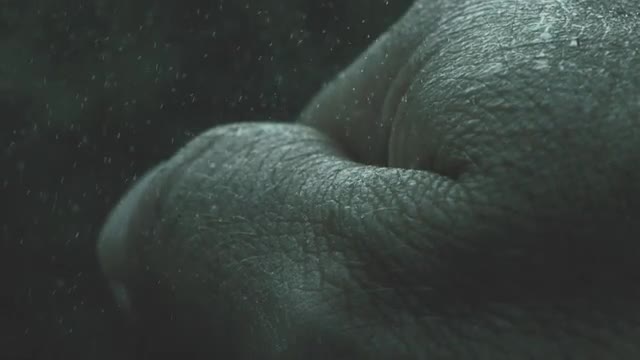 Clenching Hand Rain Slow Motion