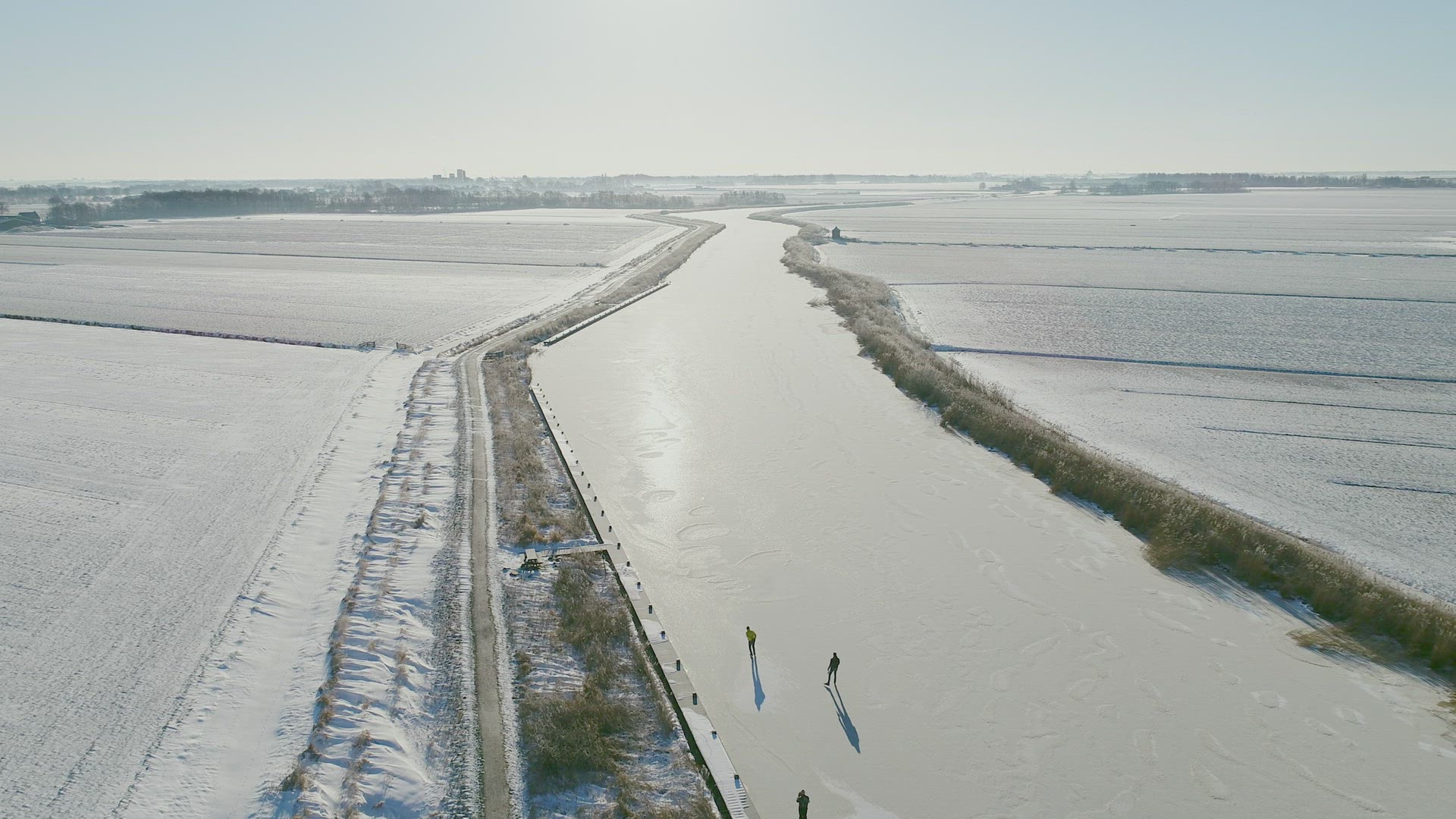 People ice skating on frozen river, Broek, Friesland, Netherlands